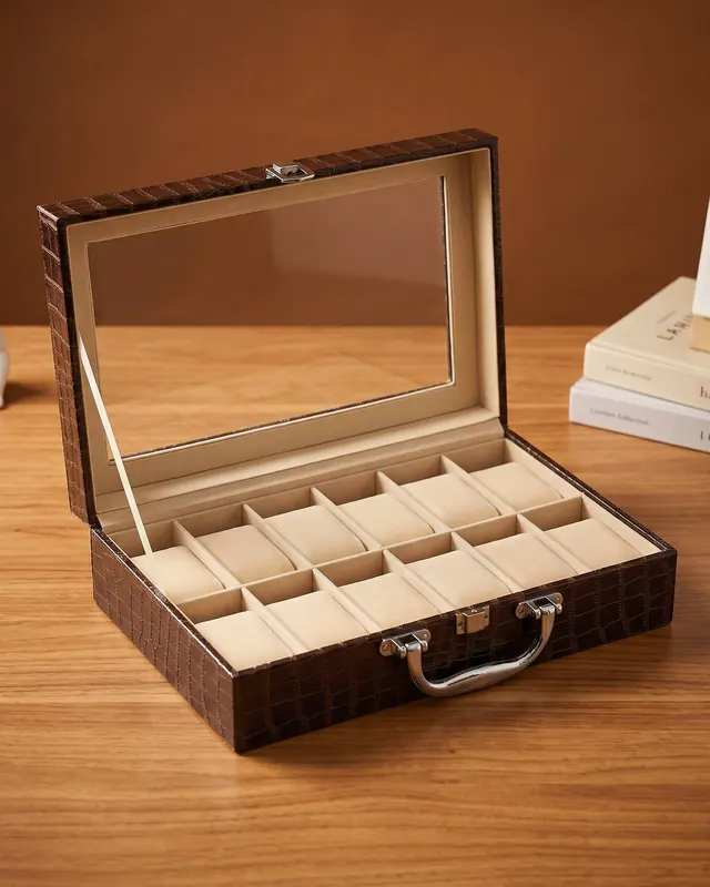 A brown leather twelve-watch box